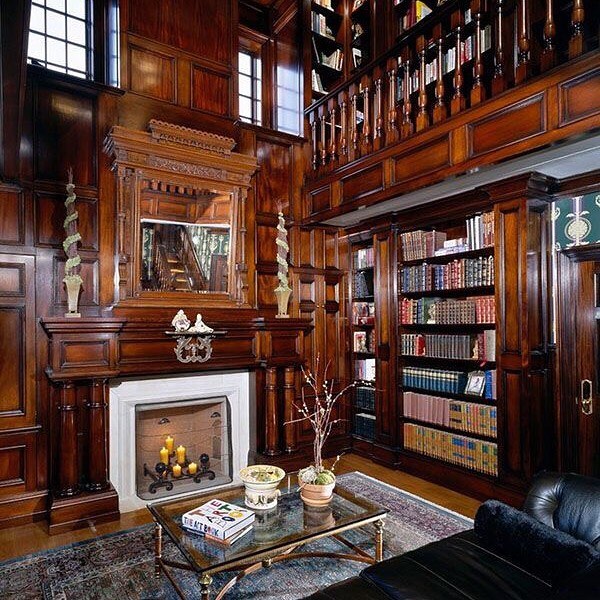 classic home library style with lots of mahogany wood photo by Instagram user @okuryazar.tv