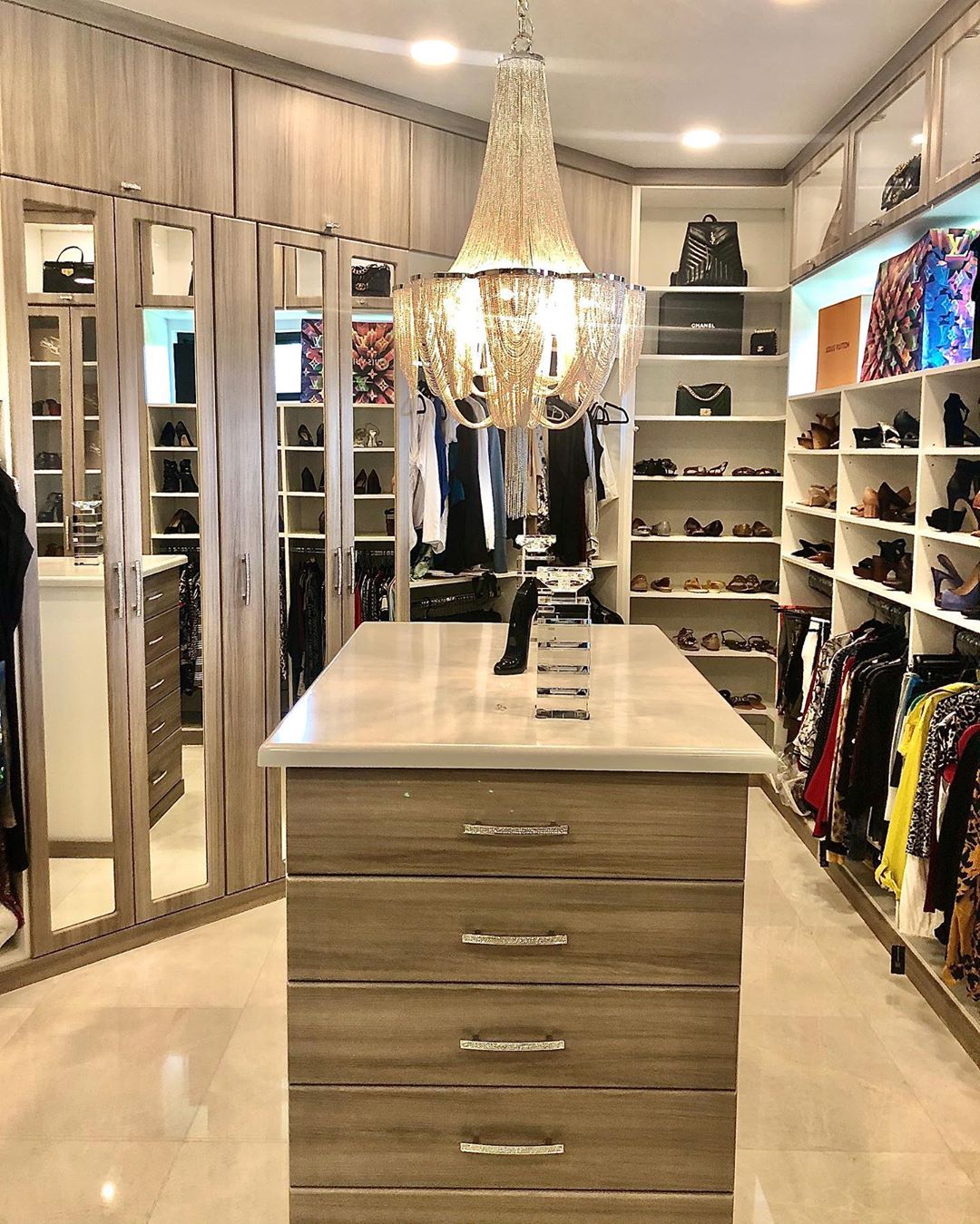 Closet with glossy tile floor. Photo by Instagram user @designedbyangelina