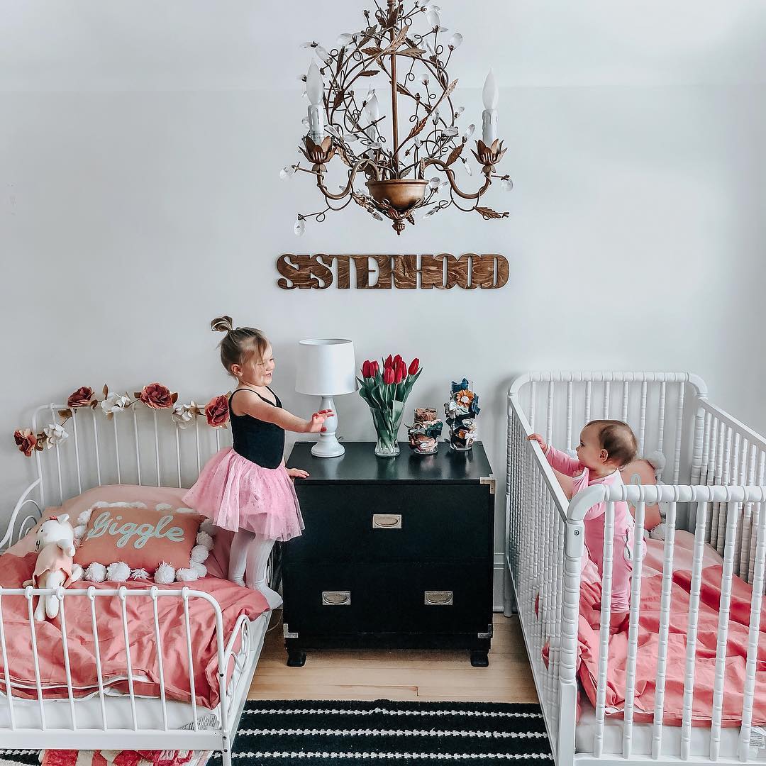 Childrens Bedroom with Neutral Colored Walls and Bedspreads. Photo by Instagram user @brunetteandbabes