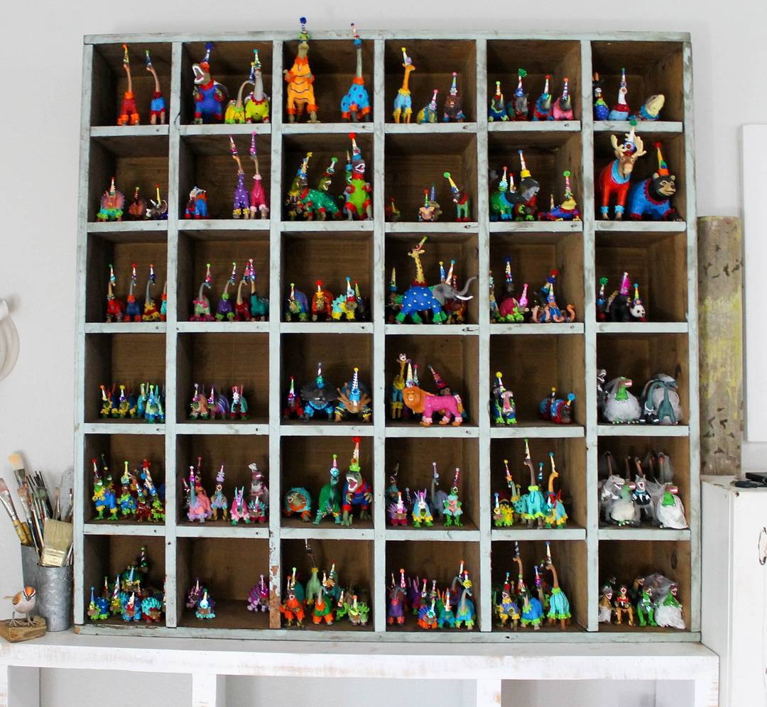 Vertical shelves in craft room. Photo by instagram user @paintedparade