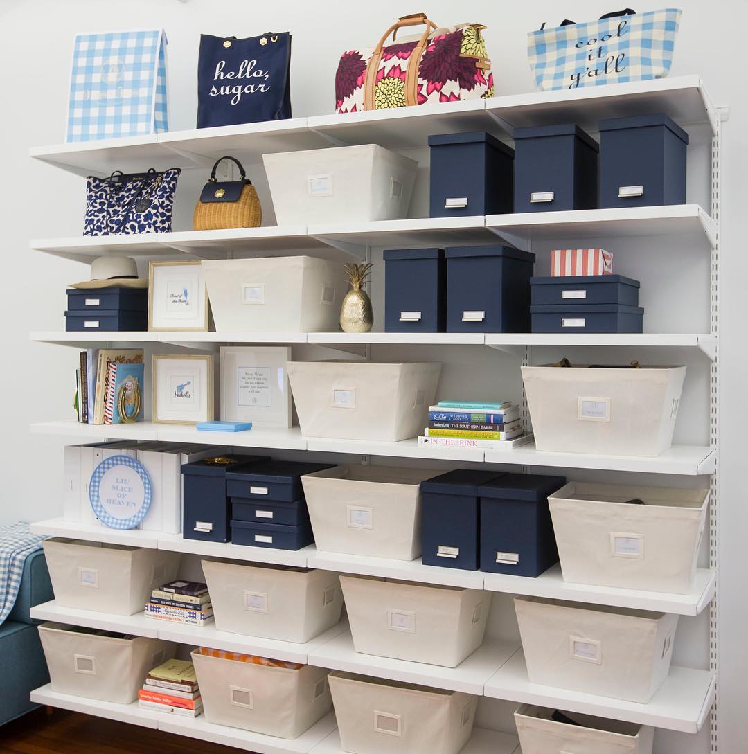 Neatly Organized Junk Room with Wall Shelving. Photo by Instagram user @thecontainerstore