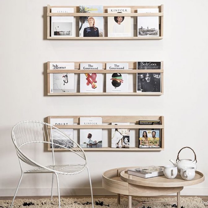 Magazines Neatly Stored on Wall of Living Room. Photo by Instagram user @designmentor