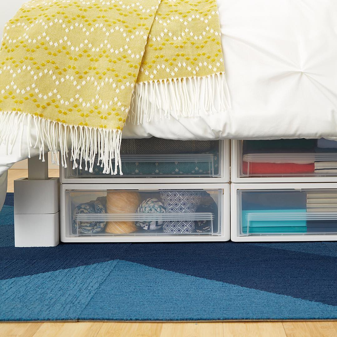Plastic Storage Containing Towels and Sheets Under the Bed. Photo by Instagram user @thecontainerstore