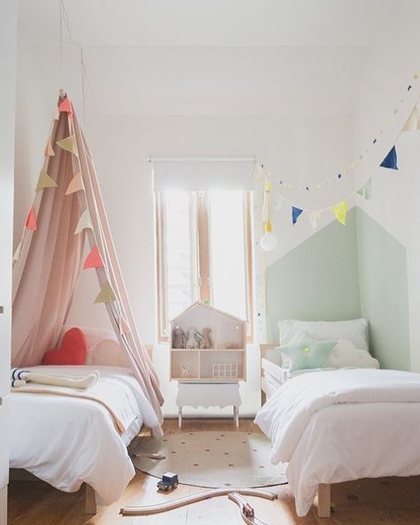 Minimalist shared kids bedroom for boy and girl siblings.