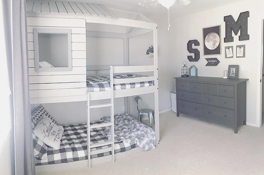 Gray-themed boys bedroom with bunks that function as playhouse.