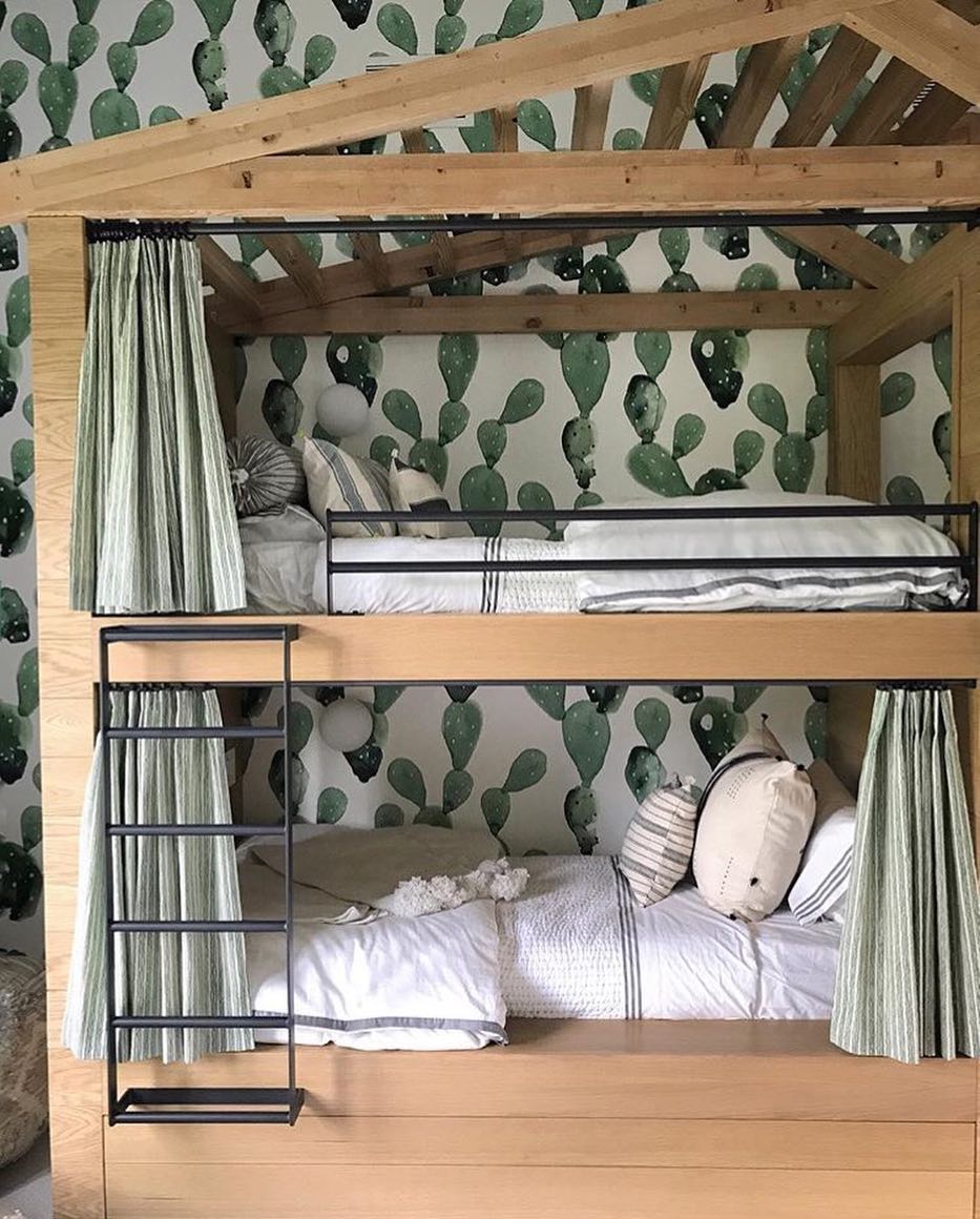 Kids bedroom bunk beds with curtains for privacy.