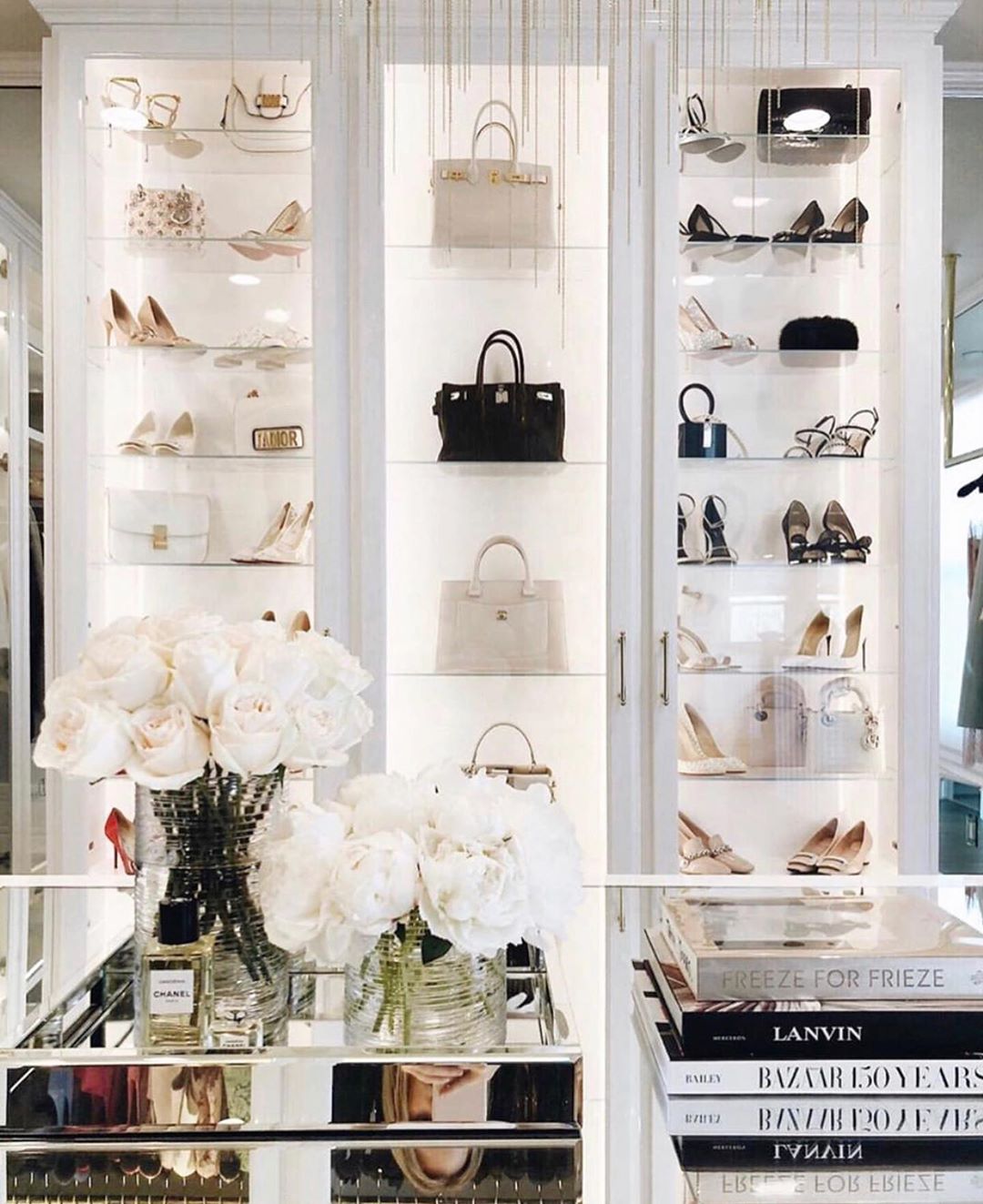 Shoes and purses in luxury closet. Photo by Instagram user @laclosetdesign