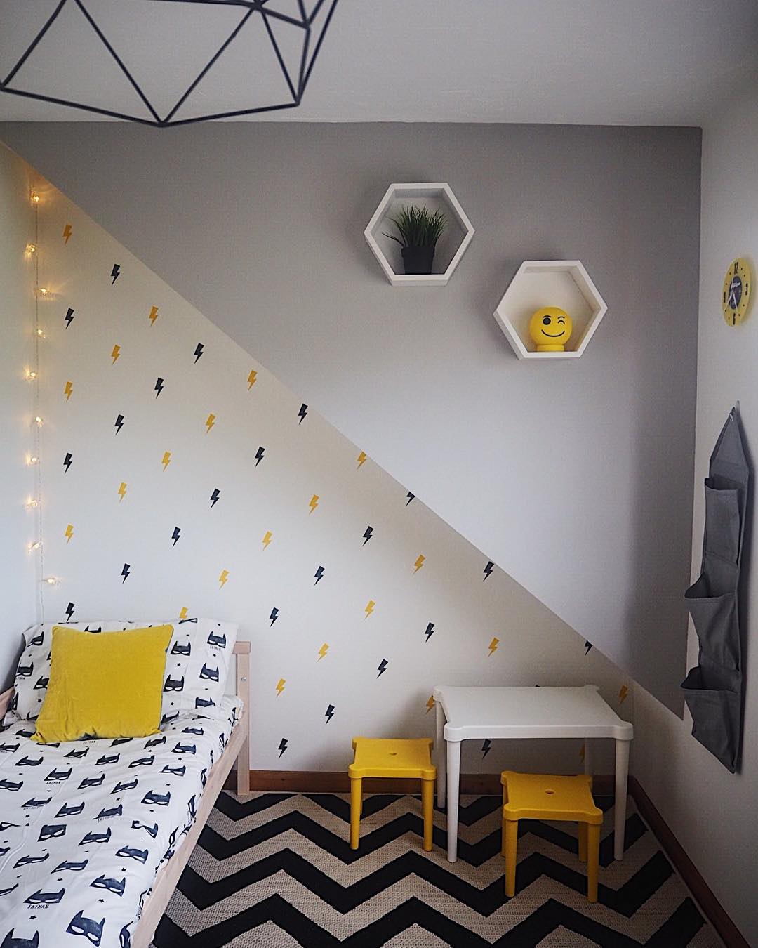 Small Kids Bedroom Heavily Decorated with Lightning Bolts on Walls and Colorful Furniture. Photo by Instagram user @melanielissackinteriors