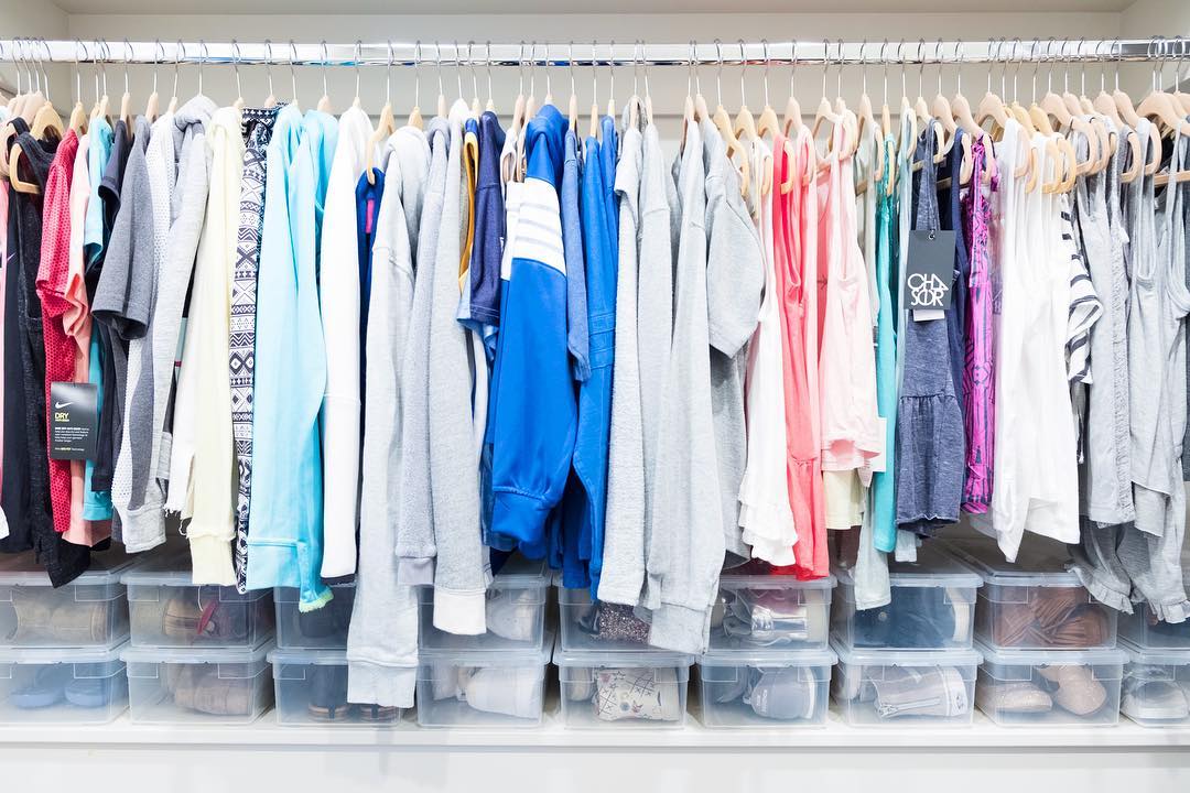 Childrens Clothes Hung in Closet and Stored in Plastic Bins. Photo by Instagram user @thehomeedit