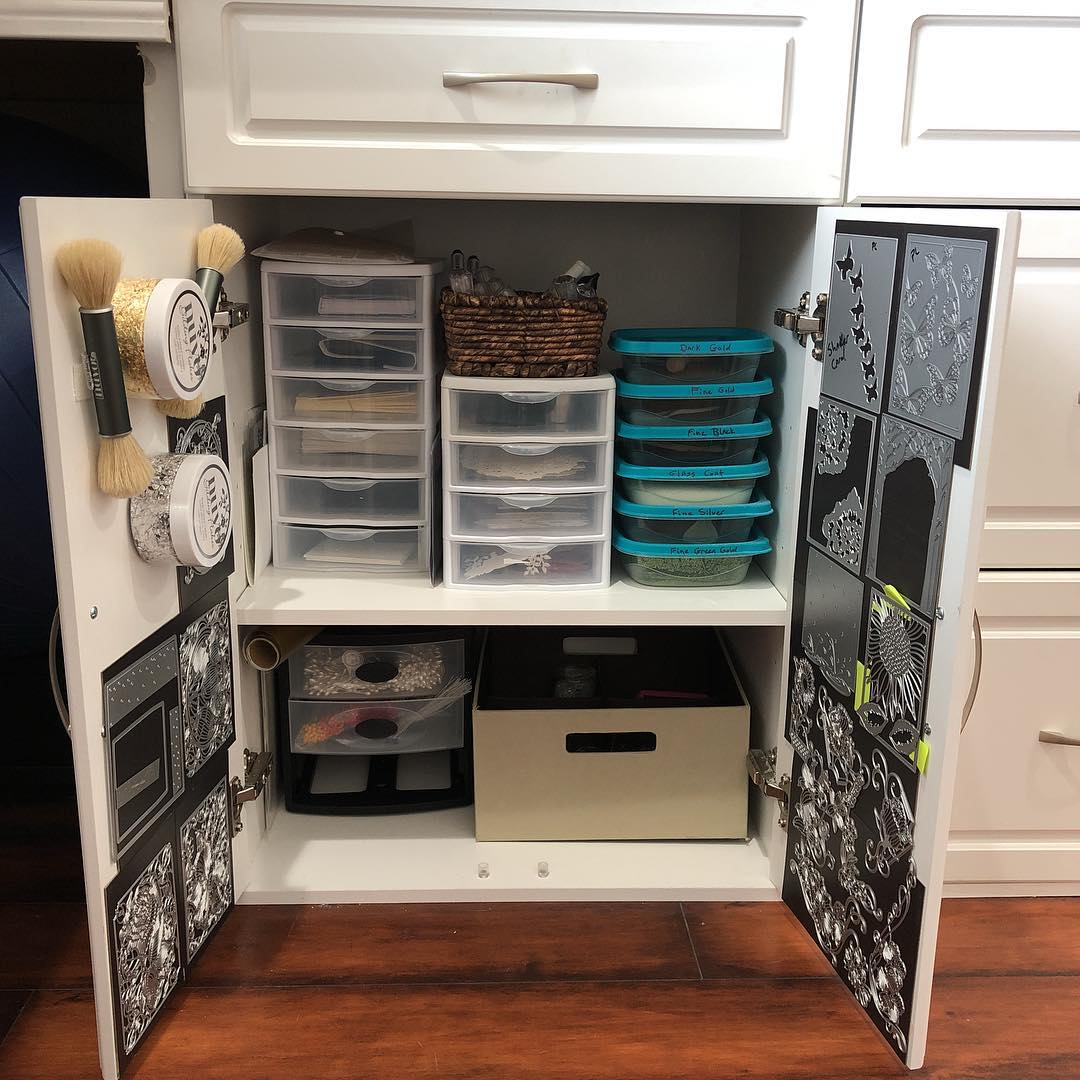 Cabinet in craft room with door space storage. Photo by Instagram user @culinary_crafter