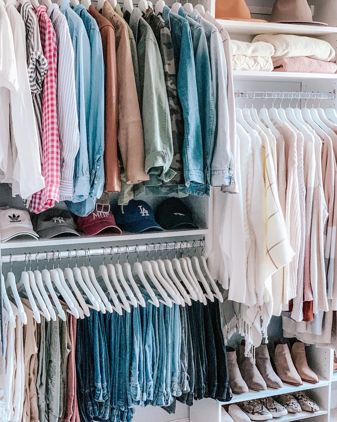 Clothing in closet on wood hangers. Photo by Instagram user @seasonsinstilettos
