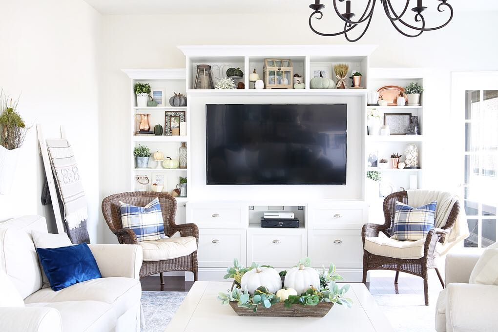 Chic white entertainment center in living room. Photo by Instagram user @abbyorganizes