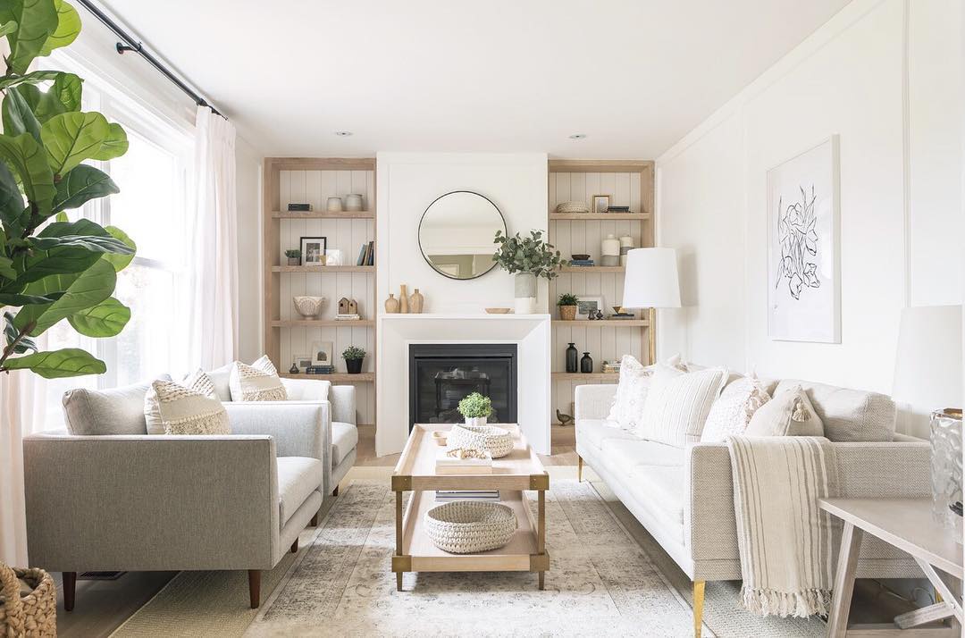 Two-tier coffee table in neutral living room. Photo by Instagram user @copycatchic