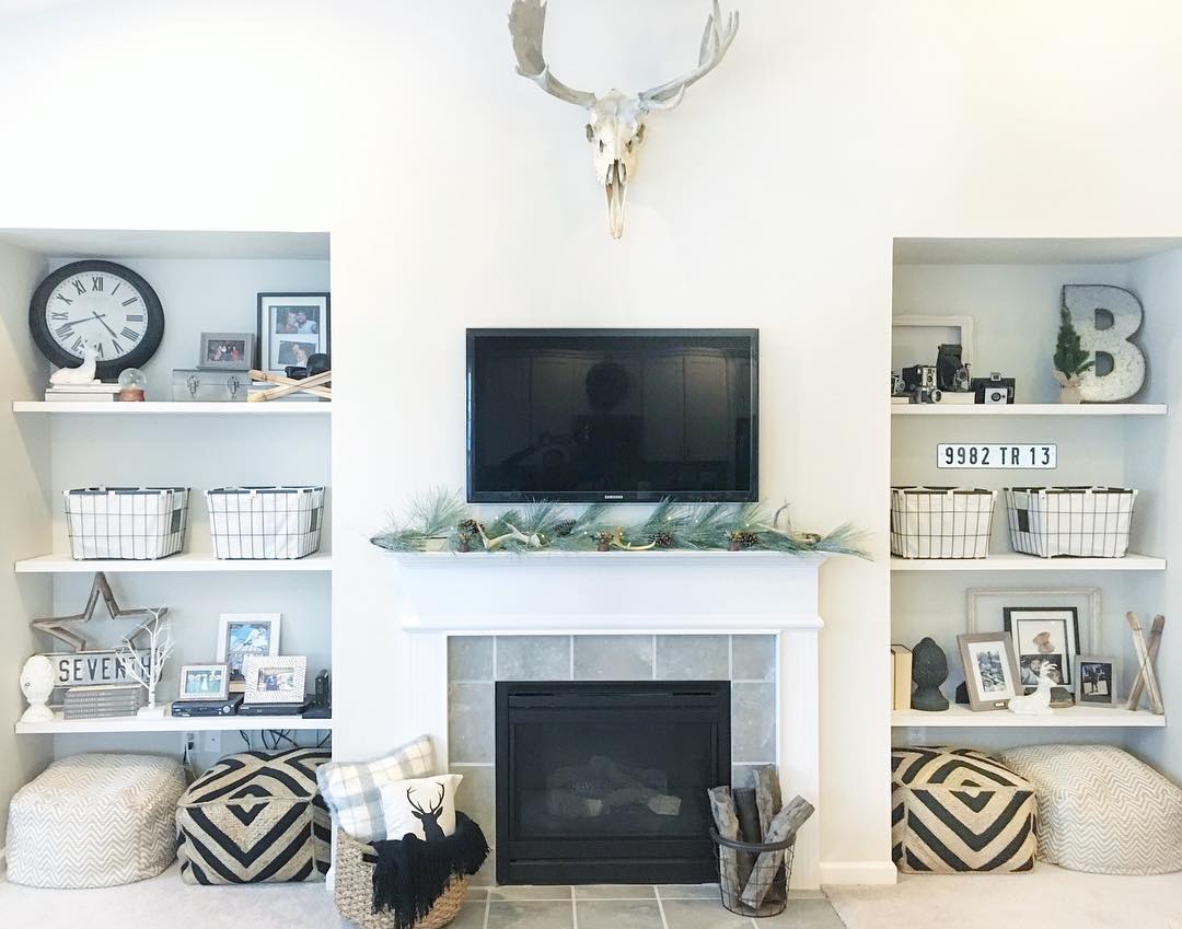 Built-in shelving on both sides of fireplace. Photo by Instagram user @georgiasattic