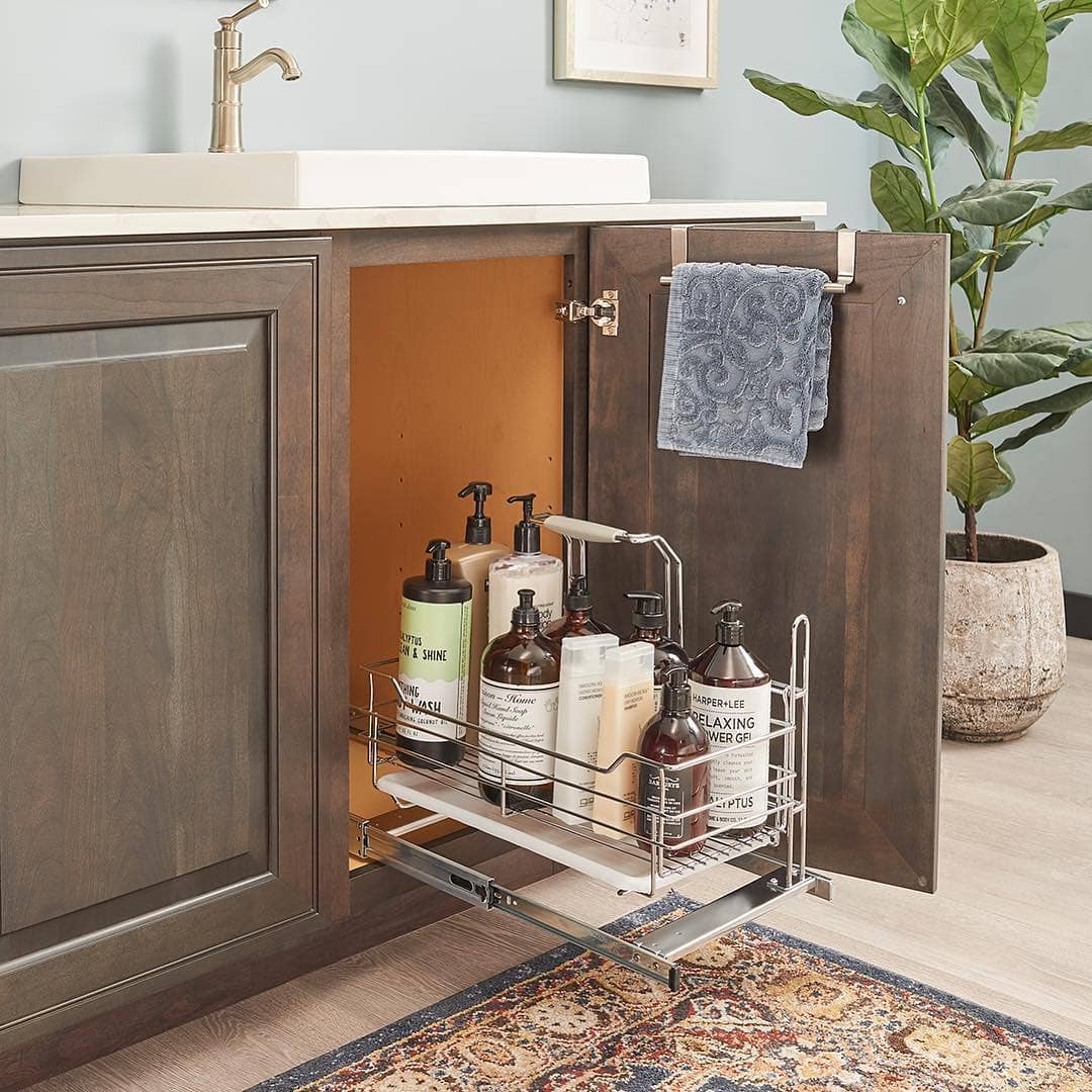 Pull-out Drawers Storing Supplies Under Bathroom Sink. Photo by Instagram user @northfieldkitchens