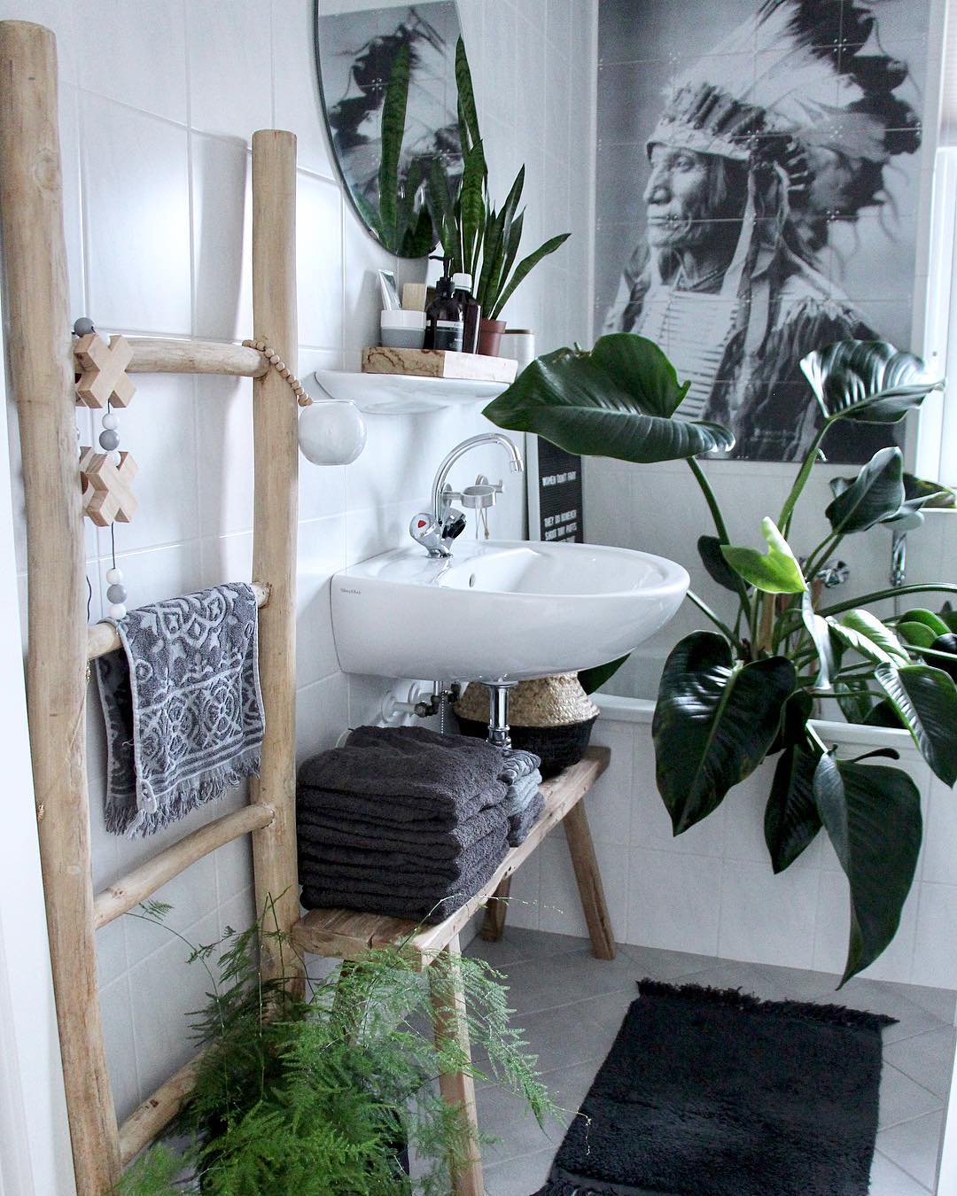 Bench with Towels Underneath Bathroom Sink. Photo by Instagram user @wonen_bij_chantal