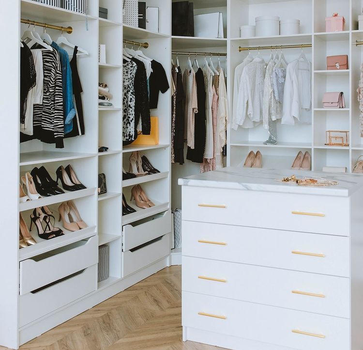 White dresser in a bright walk-in closet. Photo by Instagram user @decluttrme.
