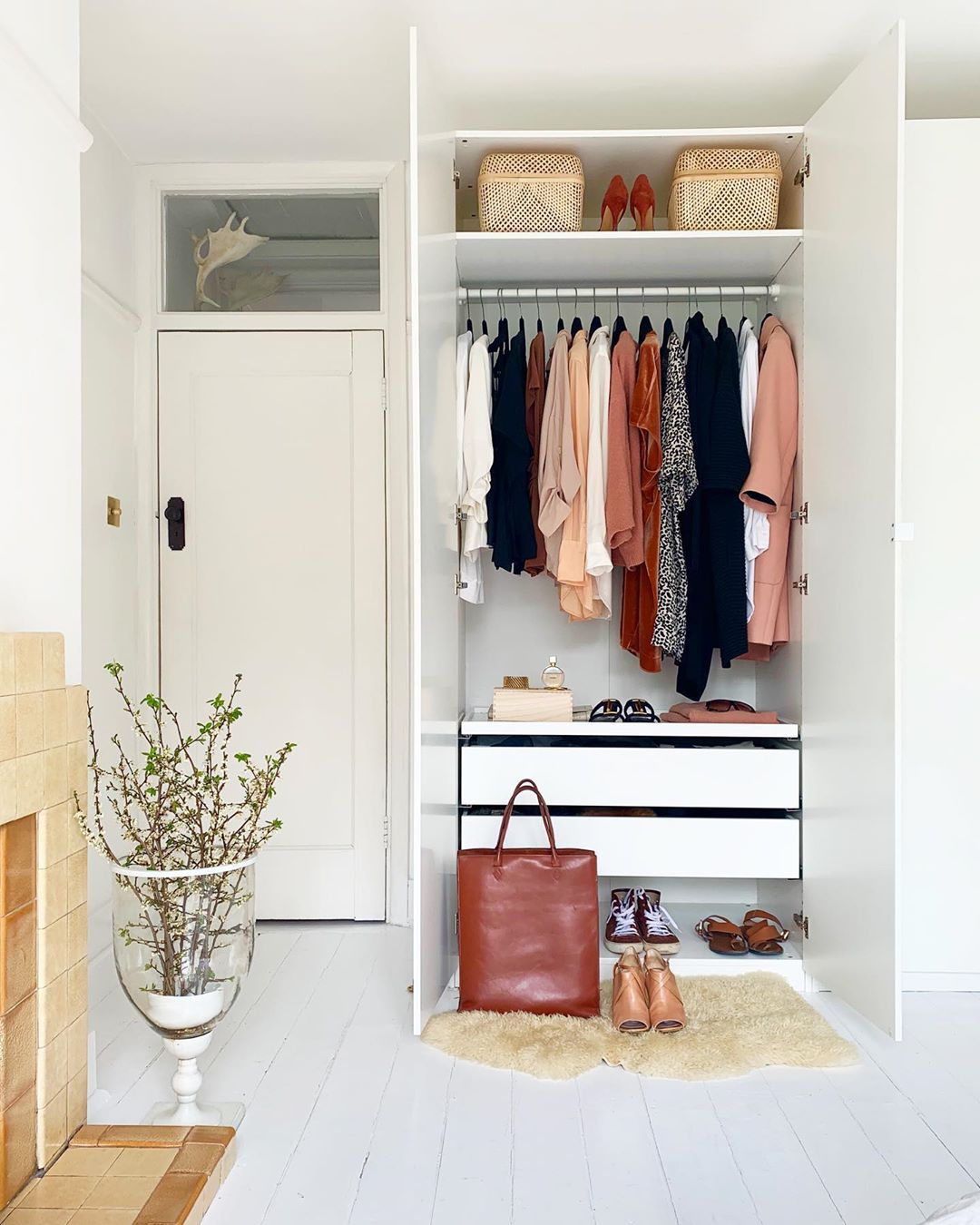 Closet with Dresser Installed Below Clothes. Photo by Instagram user @millatawast