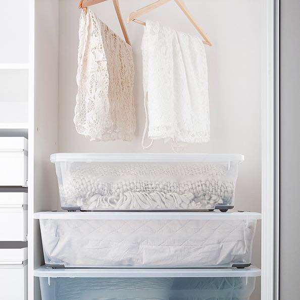 Clear Containers Storing Sheets and Blankets. Photo by Instagram user @ezystorage