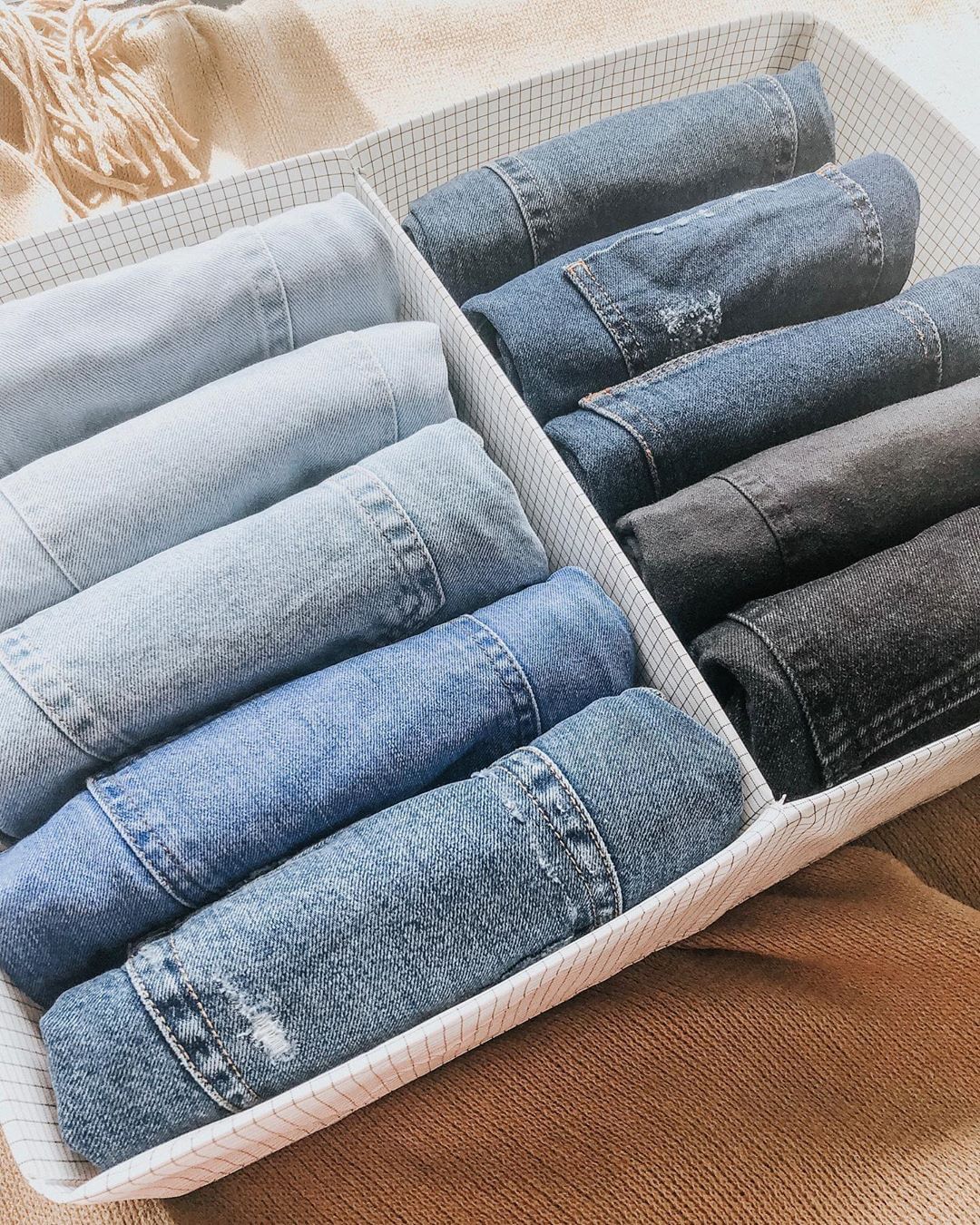 Jeans Rolled Up into a Storage Basket. Photo by Instagram user @zenwithjulia