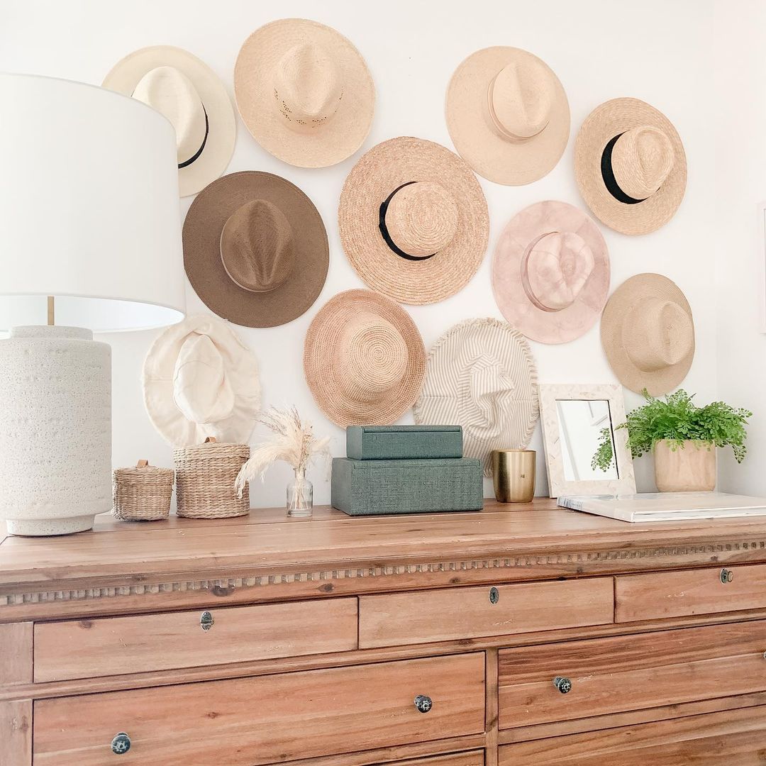 Hats Stored on a Bedroom Wall. Photo by Instagram user @adrianafarrellinteriors
