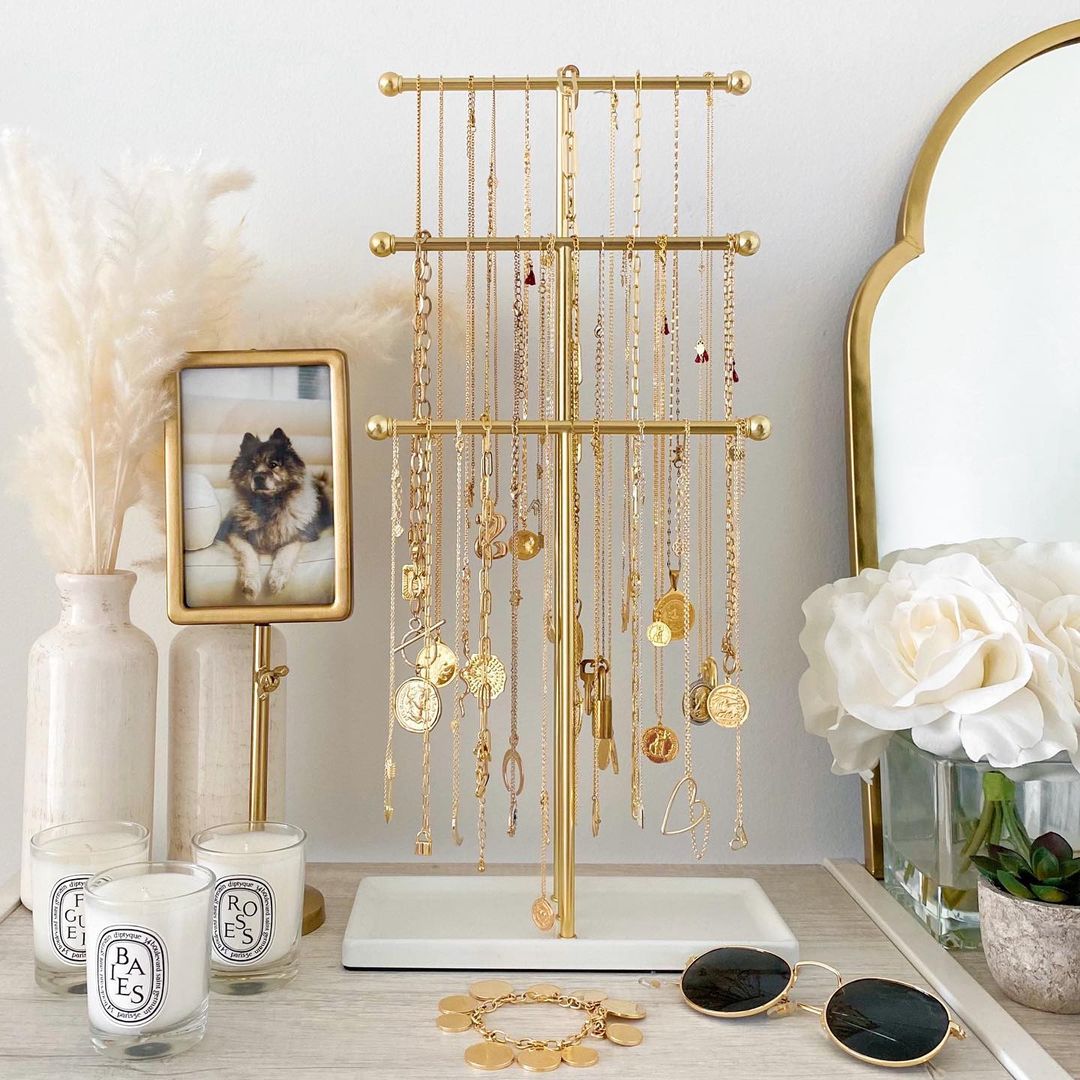 Necklaces Hanging on a Tiered Storage Rack. Photo by Instagram user @thehouseofsequins
