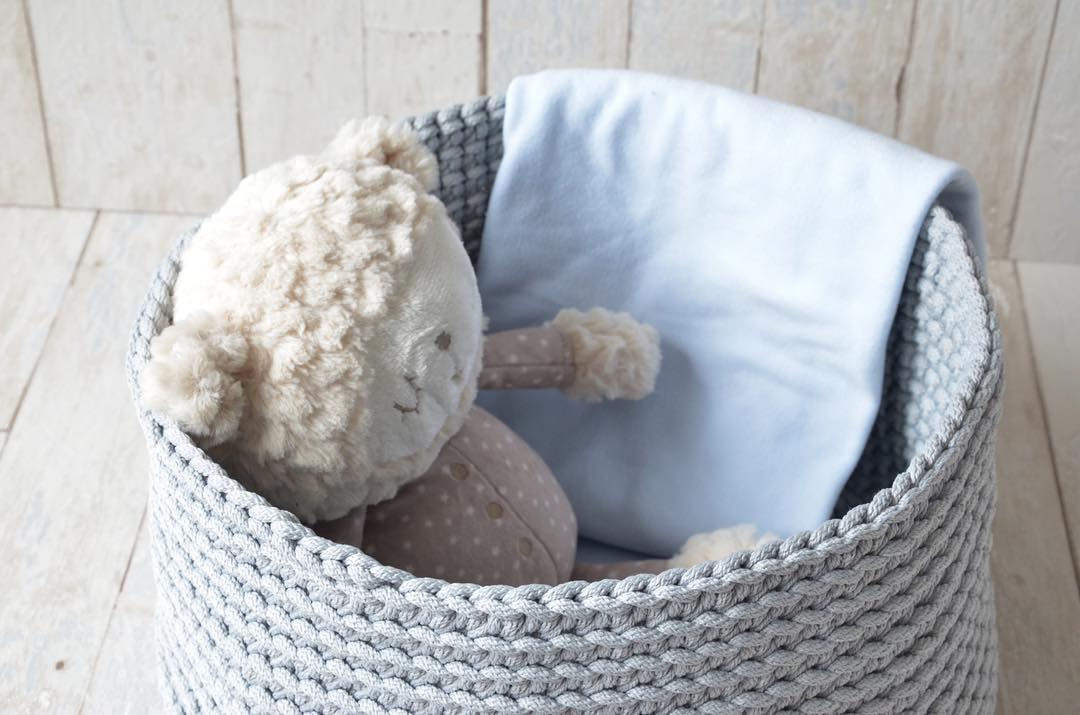 Woven Basket with Blankets and Stuffed Animals. Photo by Instagram user @catinbasket