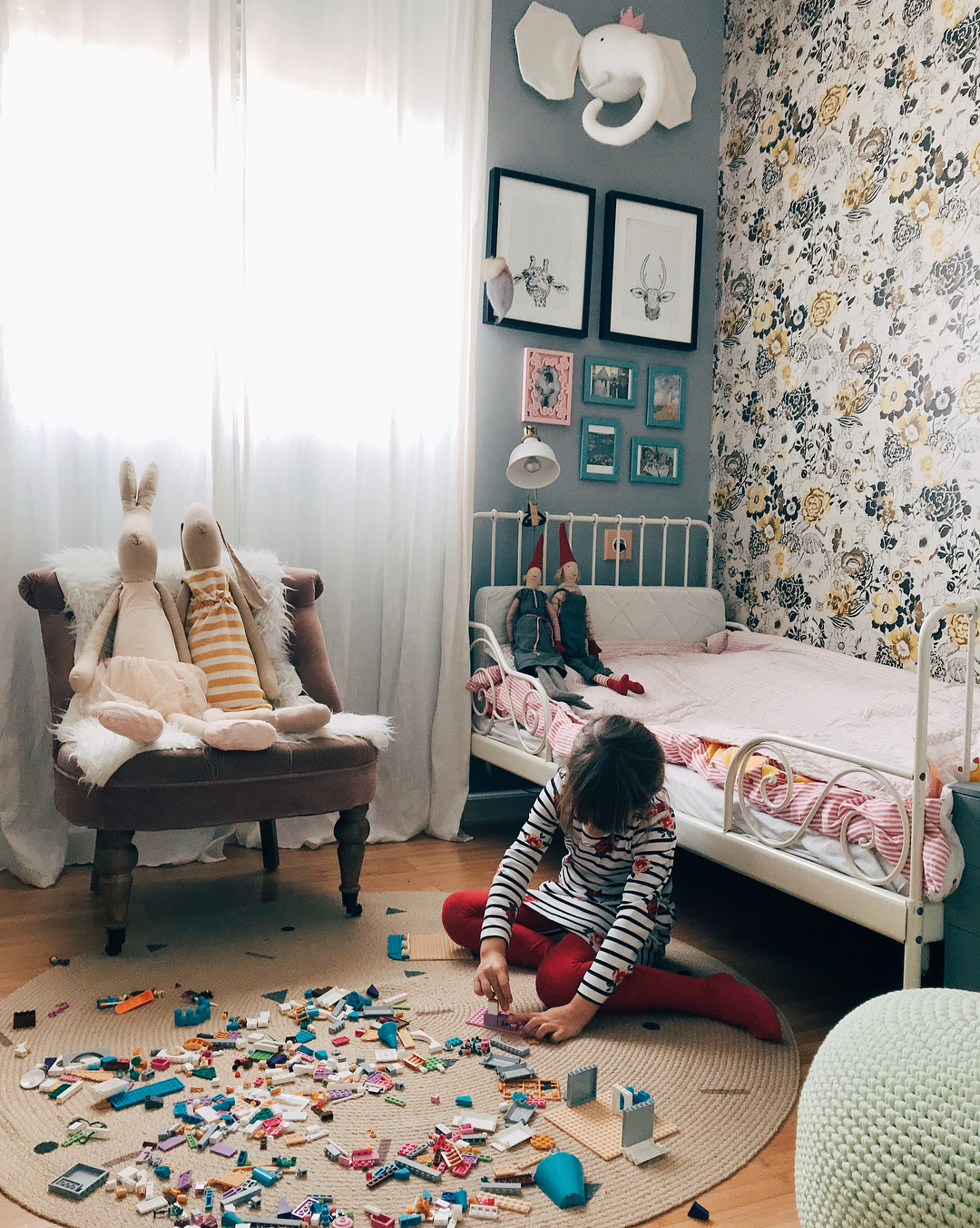 Child Playing on the Floor of Neat Bedroom. Photo by Instagram user @nastia_tsvetaeva