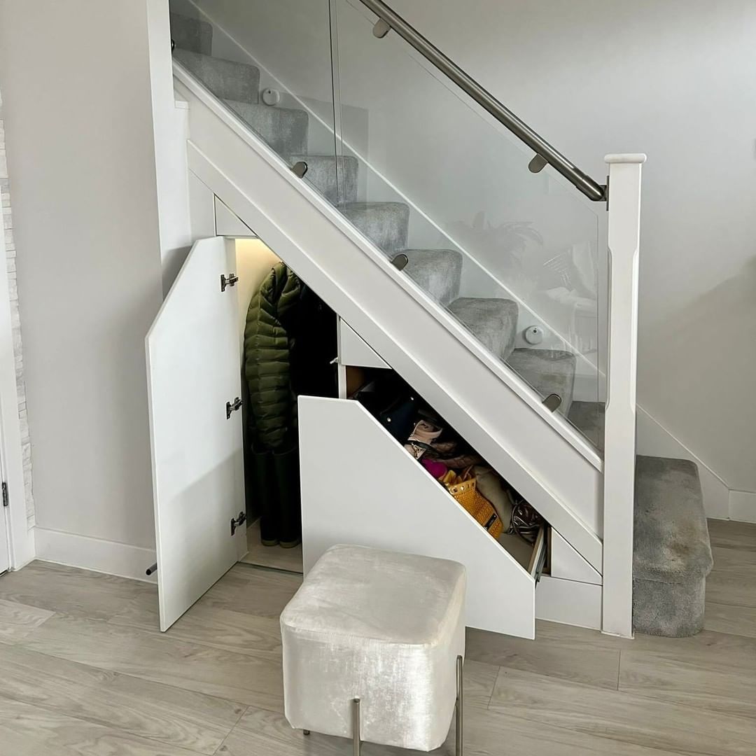 Staircase with pull-out storage and closet-like storage. Photo by Instagram user @northstonehampark.