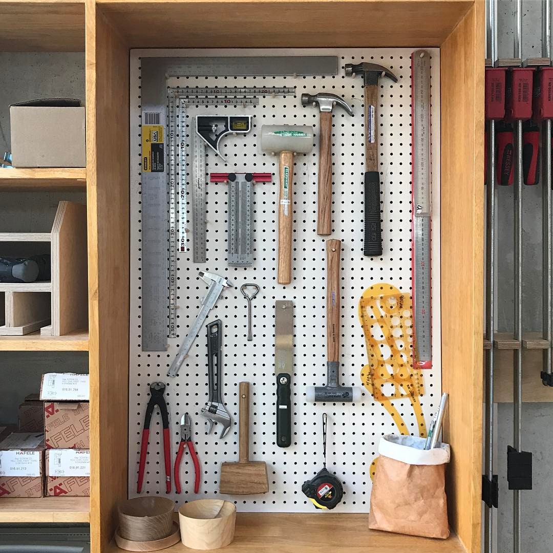 Hammers and Tools Hung on Wall Behind Garage Workbench. Photo by Instagram user @sinline503