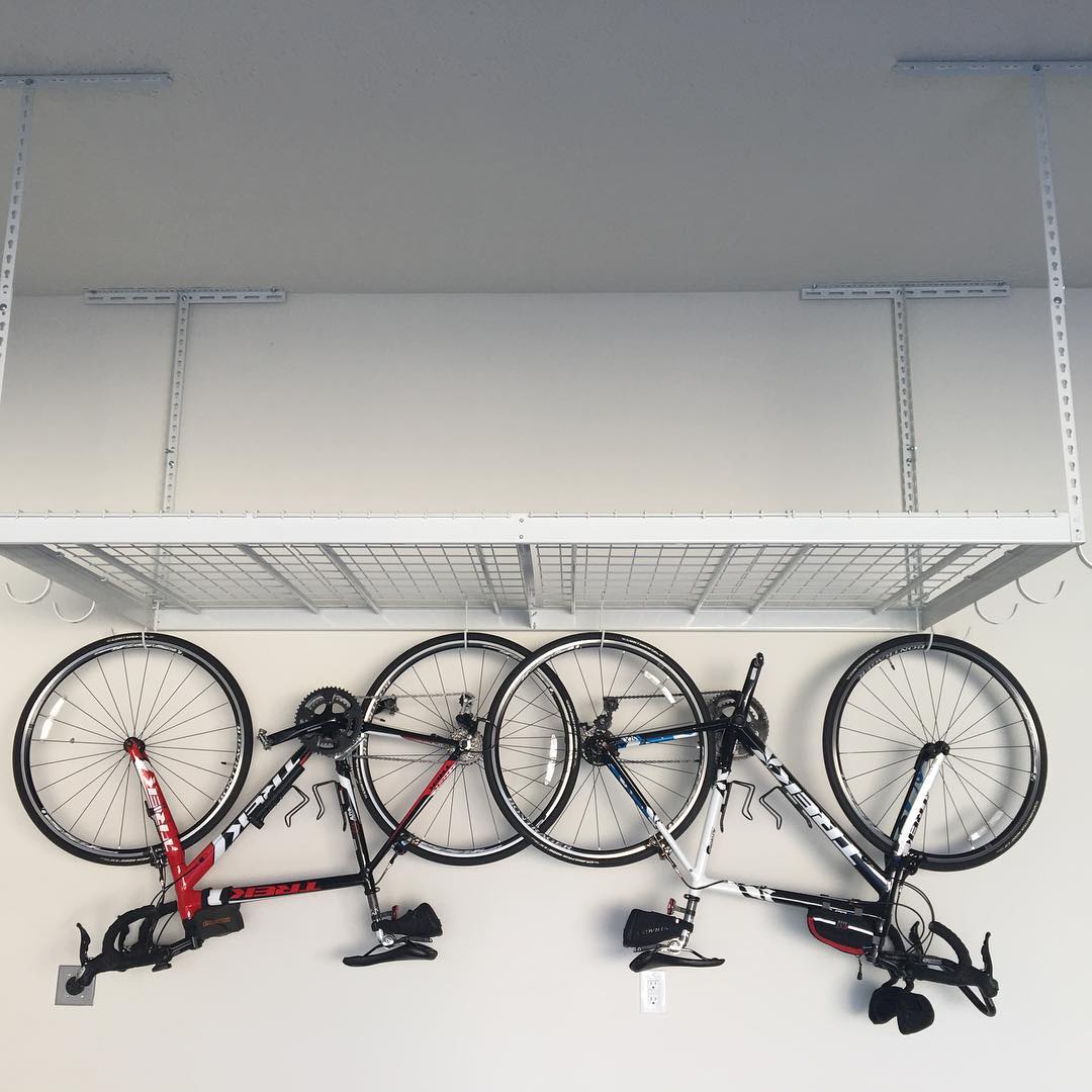 Bikes Hung From Storage Racks in Garage. Photo by Instagram user @lbagley1