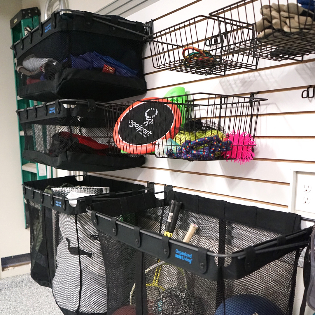 Sports Equipment Stored in Baskets and Bins on Garage Wall. Photo by Instagram user @kuzakscloset