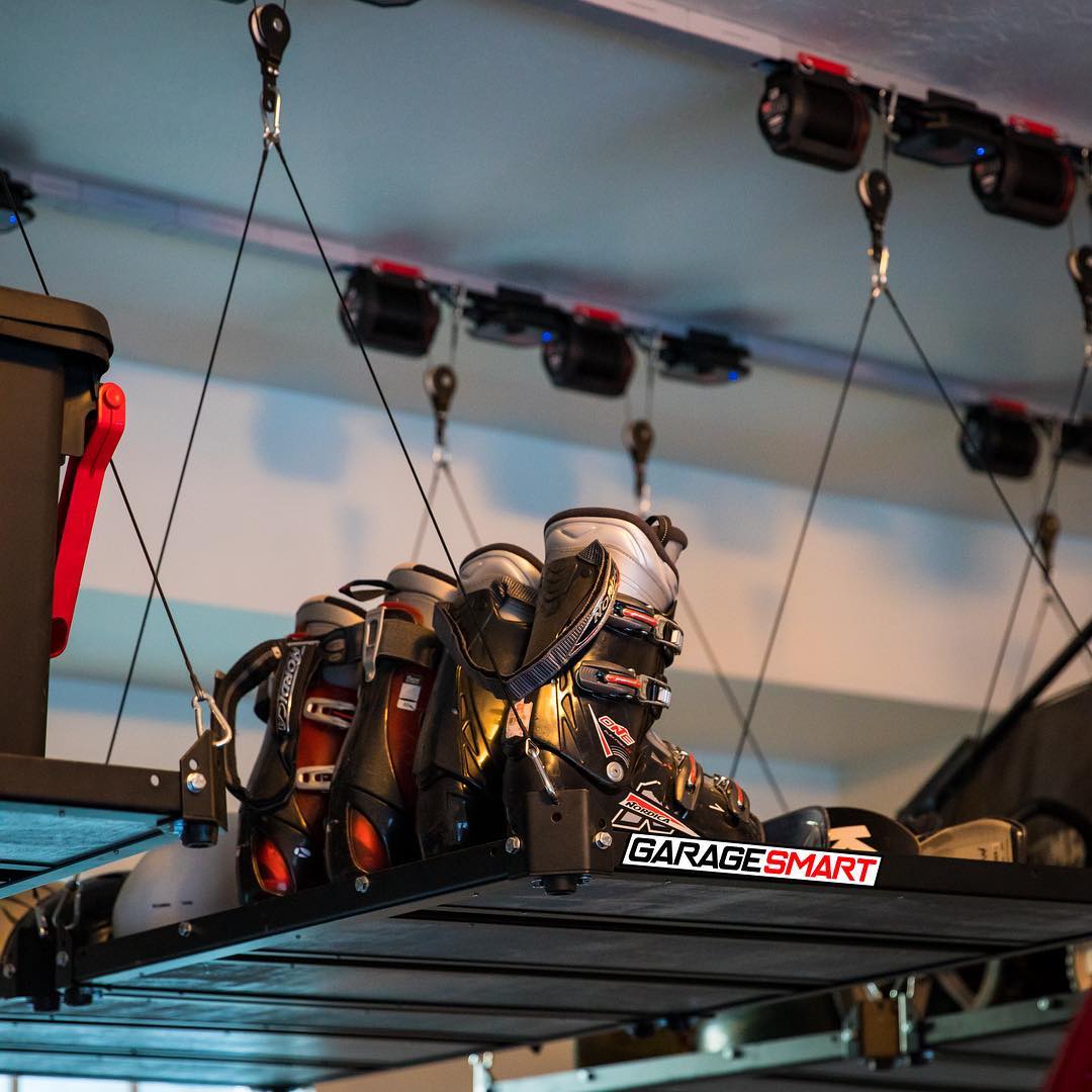 Skis and Helmets Stored on Garage Ceiling. Photo by Instagram user @garagesmart