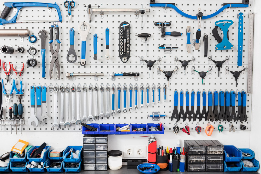 Organized workbench with tools hanging from pegboard