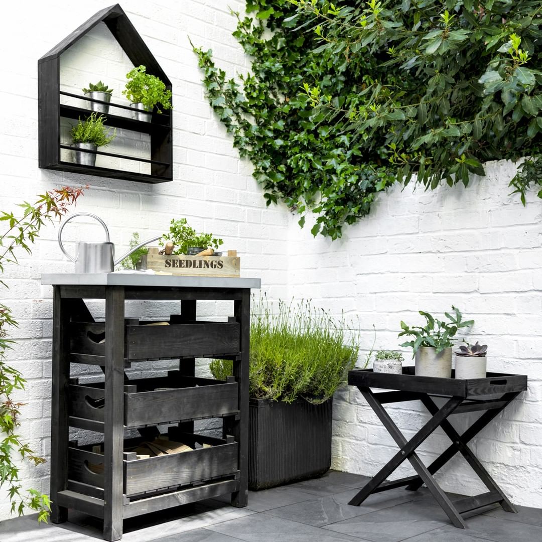 A storage cabinet for outdoor decor in the backyard. Photo by Instagram user @gardentradingcompany