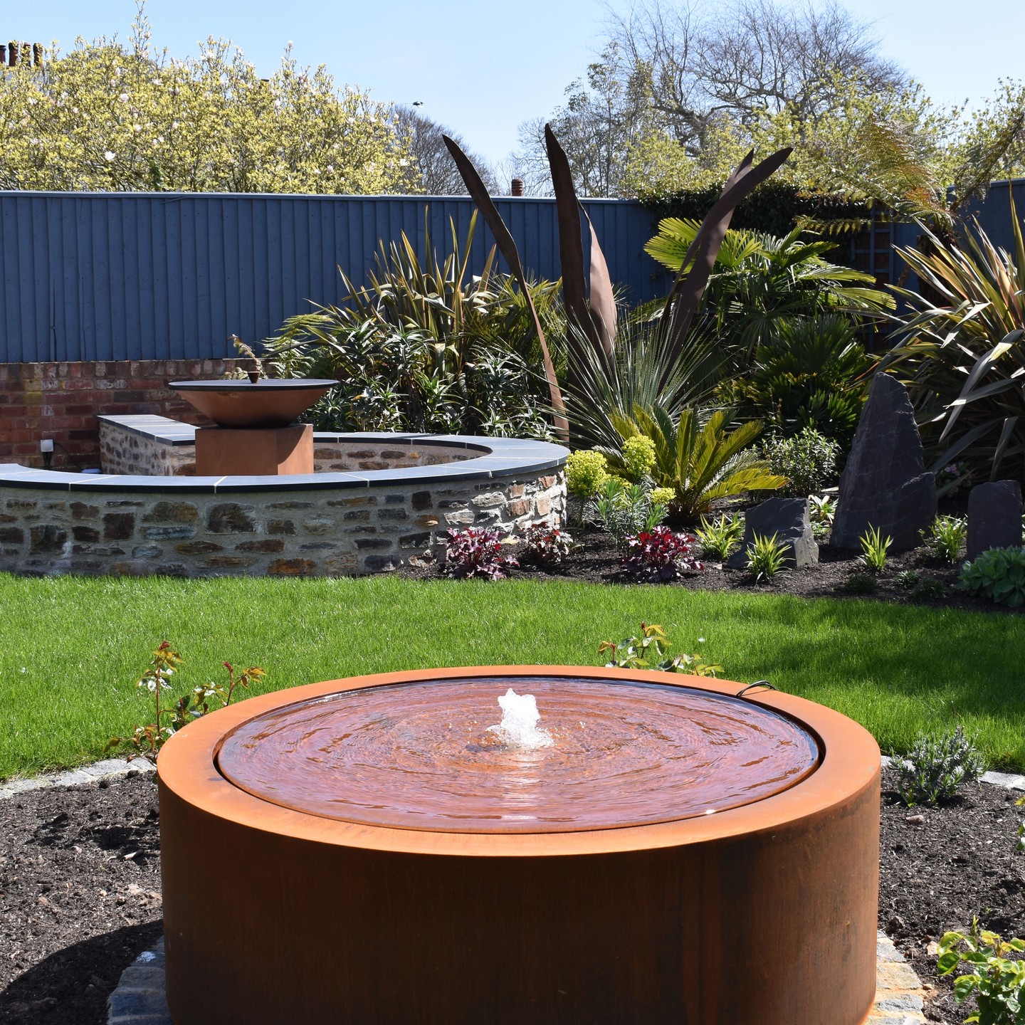 A cor-ten steel water feature in the backyard. Photo by Instagram user @greenscape_eastdevon