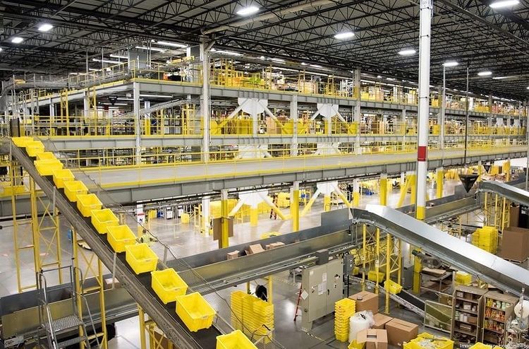 The inside of an Amazon warehouse. Photo by Instagram user @2_moms_and_a_trailer