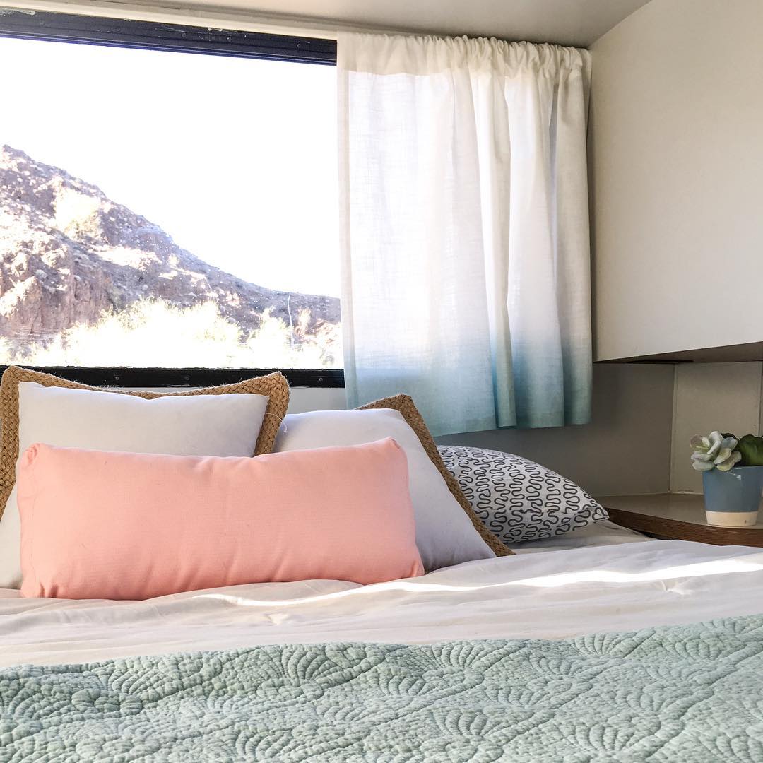 Bed inside RV. Photo by Instagram user @threebeancircus