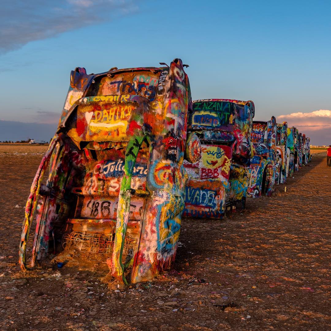 Painted Cars in the Ground at Cadillac Ranch. Photo by Instagram user @shotsbyandy