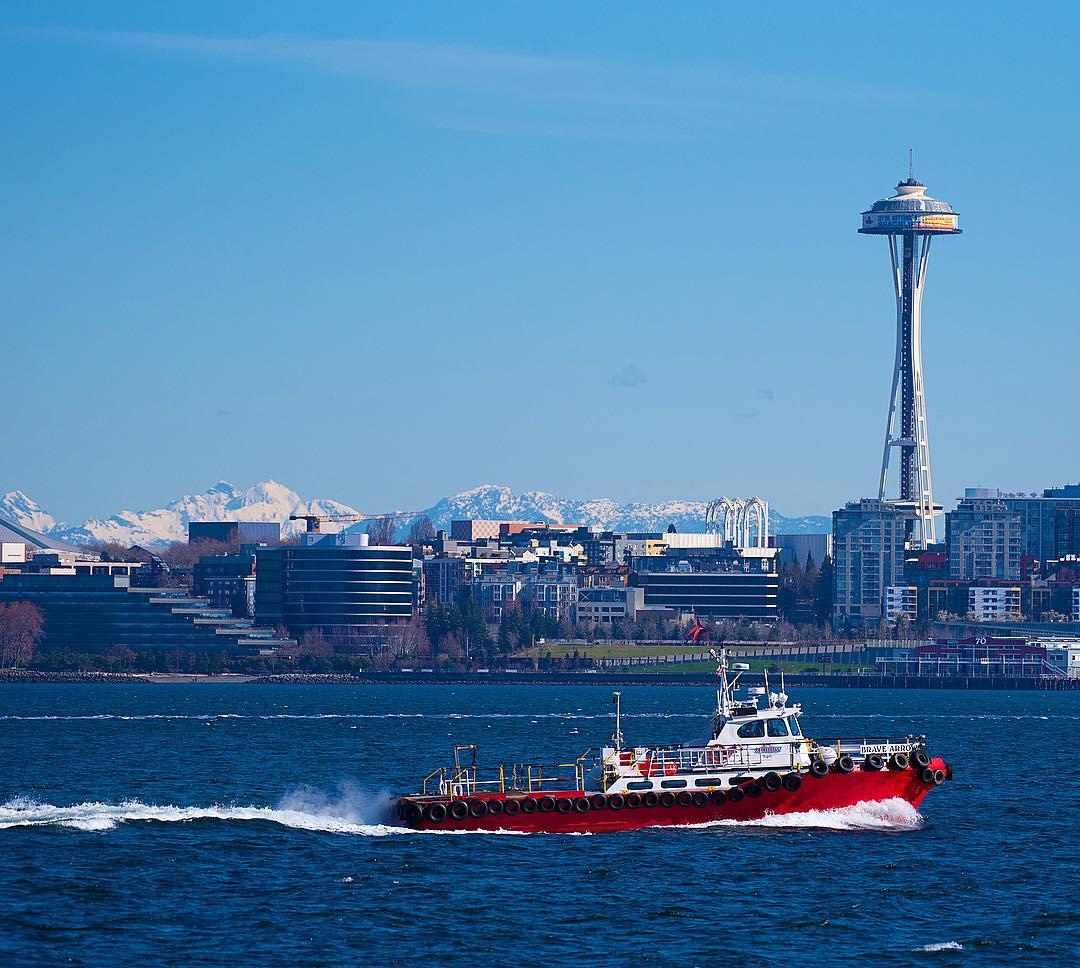 Boats on the Water in Front of the Space Needle in Seattle. Photo by Instagram user @snarielwala