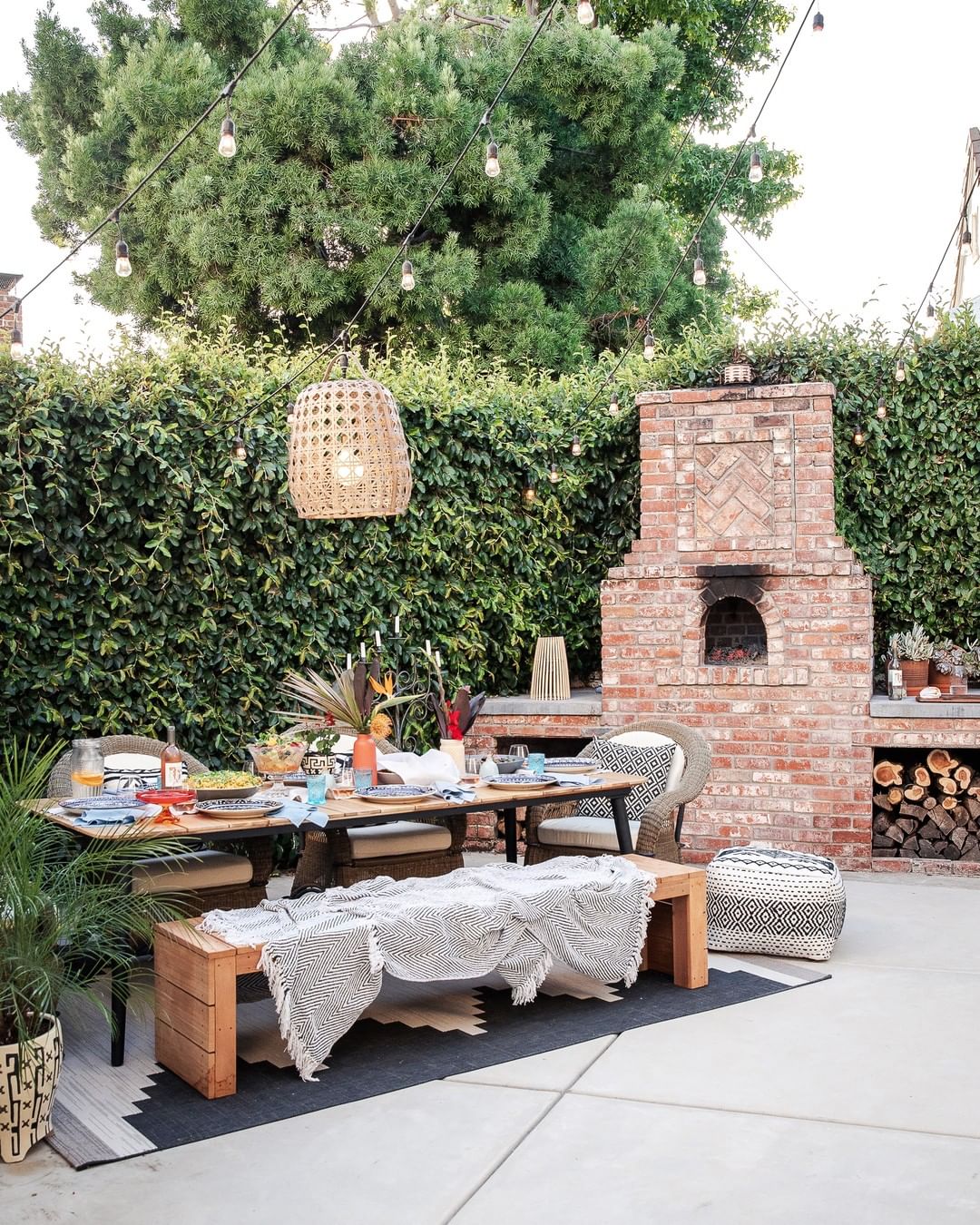 unique overhead lighting above outdoor dining room table photo by Instagram user @lonnymag