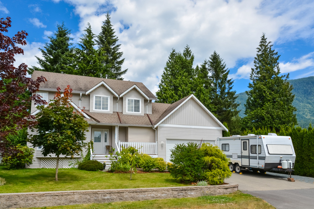 House with camper parked in driveway