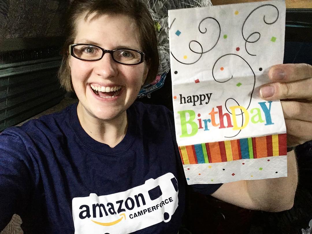 Amazon CamperForce Worker Holding Up a Happy Birthday Sign from Her Employer. Photo by Instagram user @rebekahs_adventures