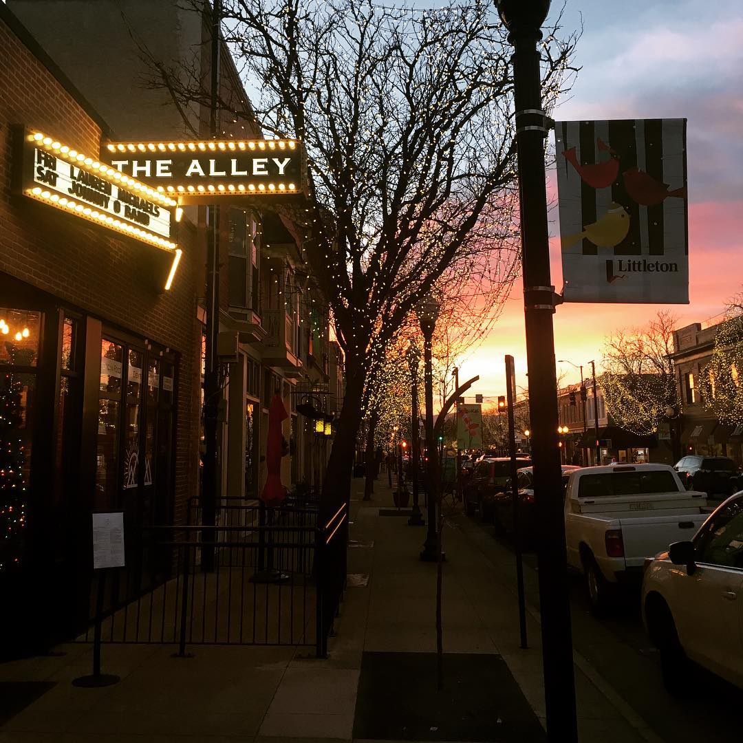 Looking down a Littleton street at sunset in front of The Alley venue Photo by Instagram user @benhammondmusic