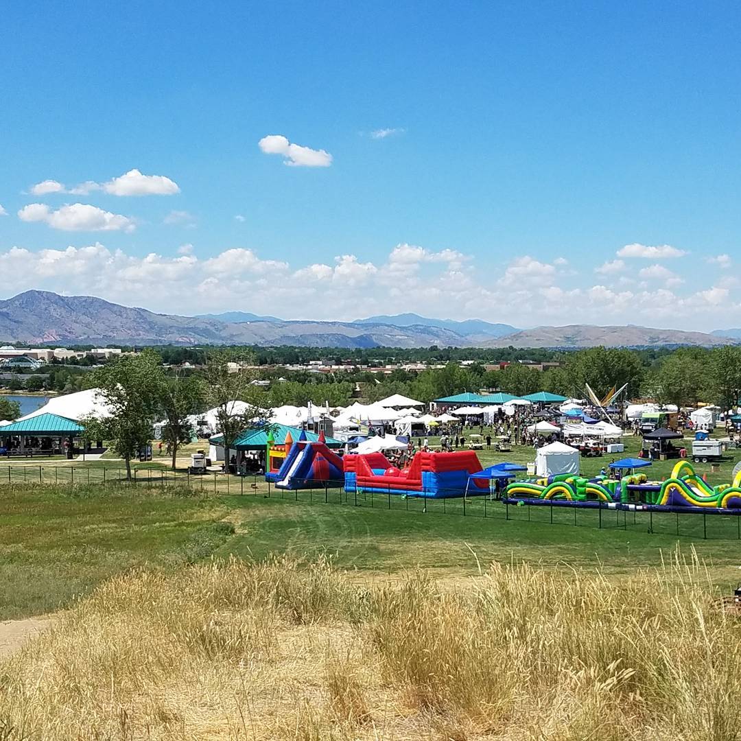 Overlooking tents and vendors at the Colorado Irish Festival with mountains in the background Photo by Instagram user @jpflynn11