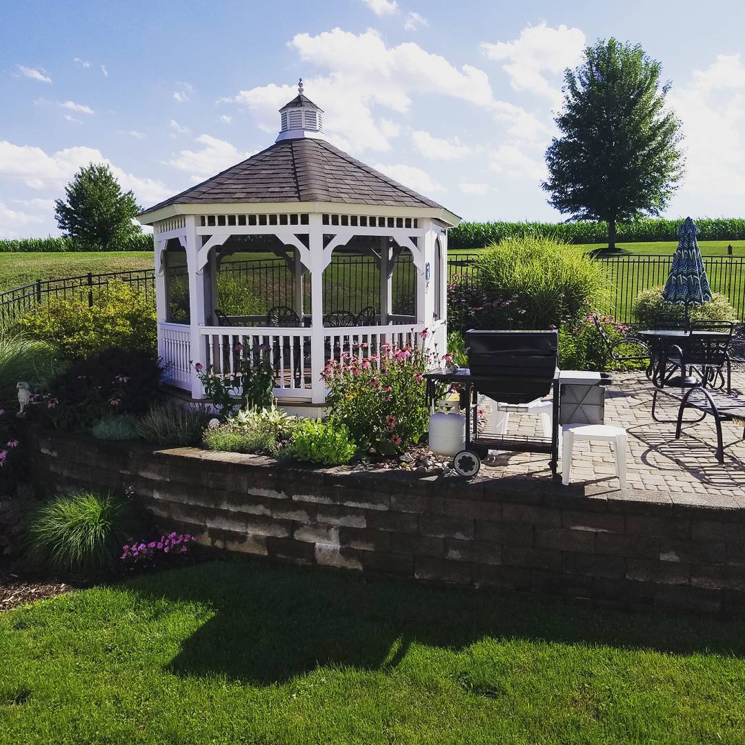 white gazebo with screens installed attached to a patio photo by Instagram user @danalli4