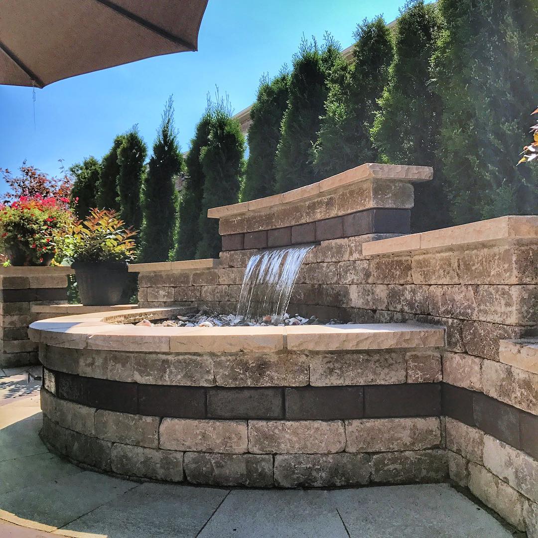 large recirculating water feature in outdoor living area photo by Instagram user @scenicstone