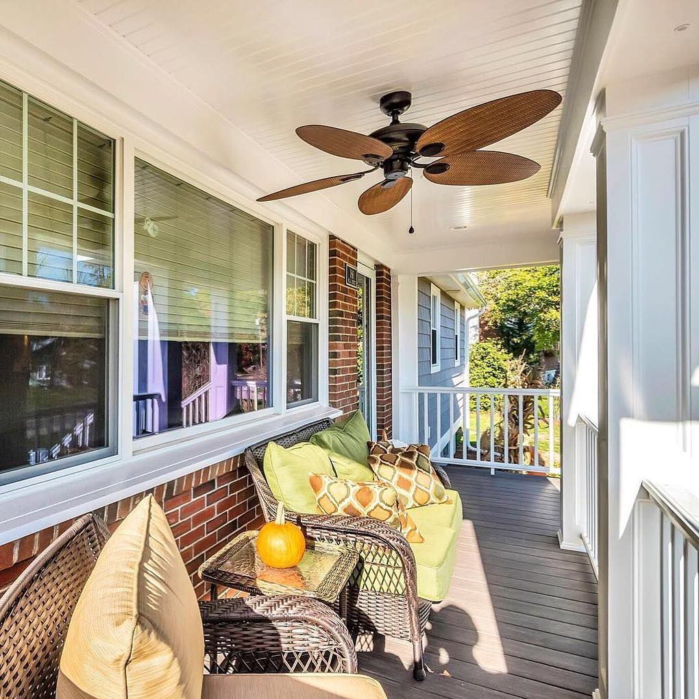 outdoor patio with furniture underneath an outdoor fan photo by Instagram user @kadilakhomes