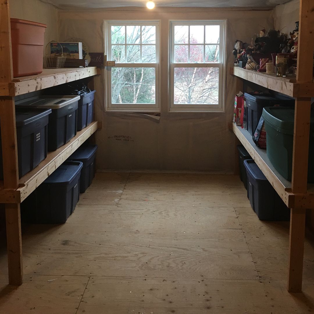 Attic Space with Homemade Wood Shelving. Photo by Instagram user @kindredorganizing