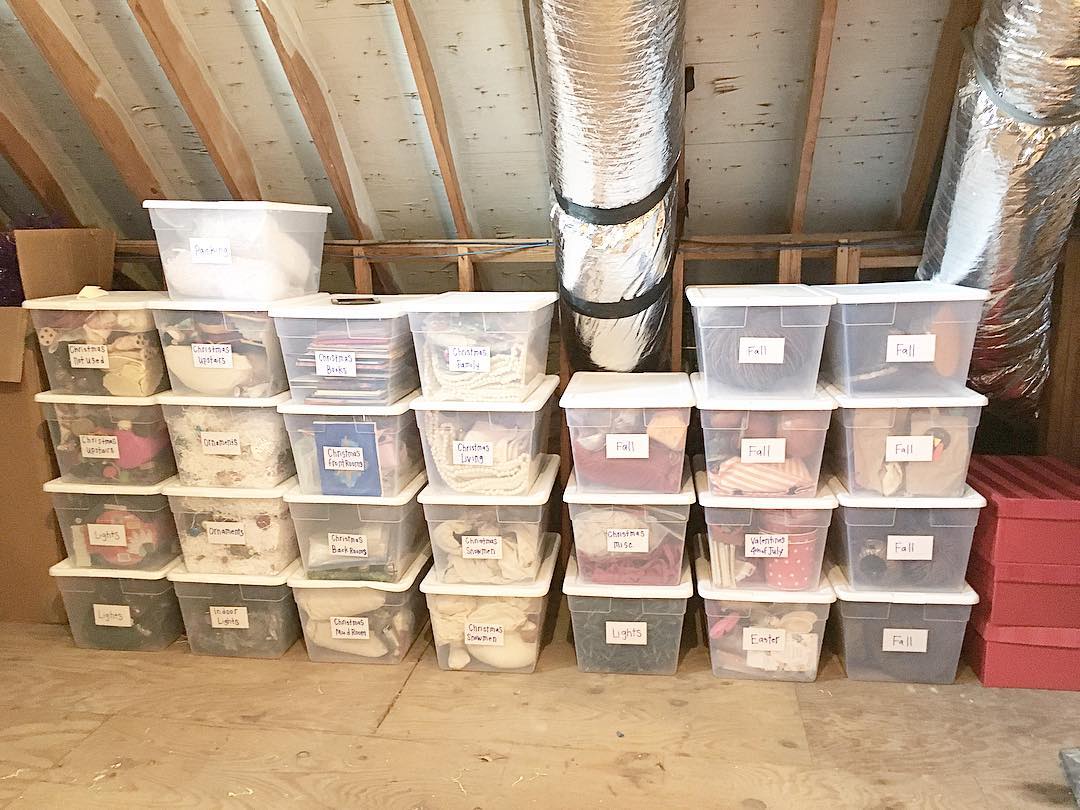 Clear Bins Stacked in an Attic. Photo by Instagram user @ecomodernconcierge